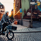 A photo of someone riding a Cake e-bike on the street.